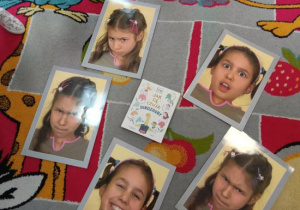 Czytanie książki o emocjach oraz nazywanie emocji przedstawionych na zdjęciach.